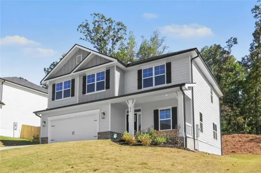 Front exterior of a new home in Thunder Ridge, Dawsonville, GA, highlighting curb appeal (Image 18).