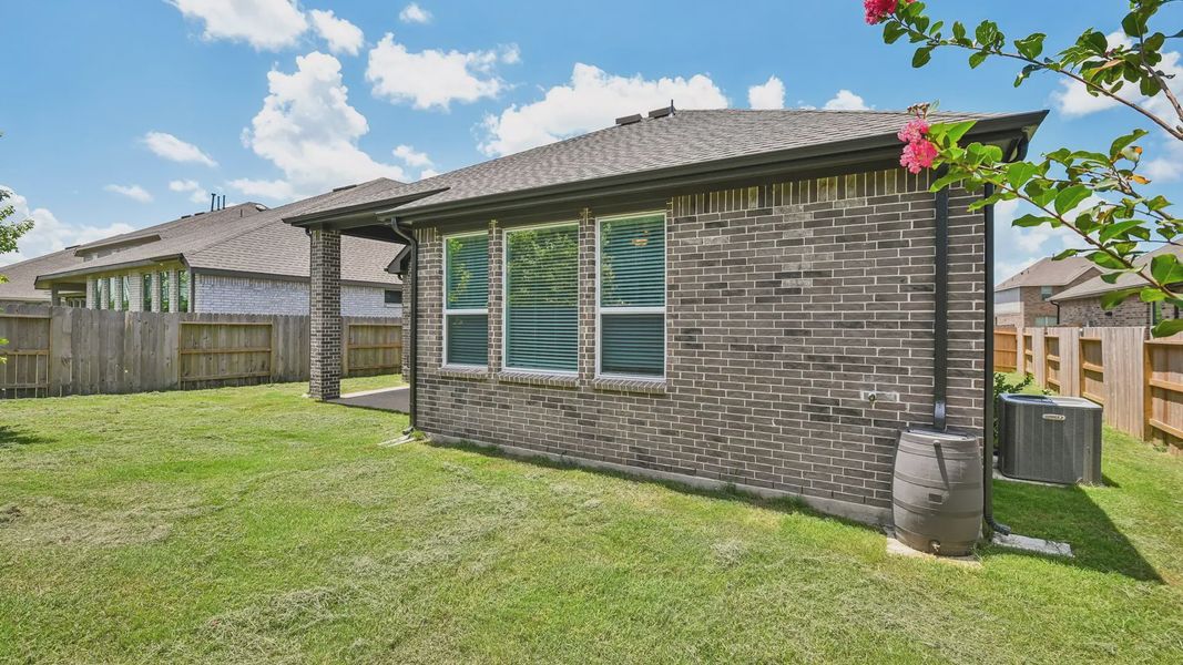 Exterior details and patio area of a home in Artavia, Conroe (Image 23).