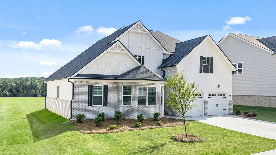Front exterior of a new home in Wildwood, Covington, GA, highlighting curb appeal (Image 1). Front exterior of a new home in Wildwood, Covington, GA, highlighting curb appeal (Image 1).