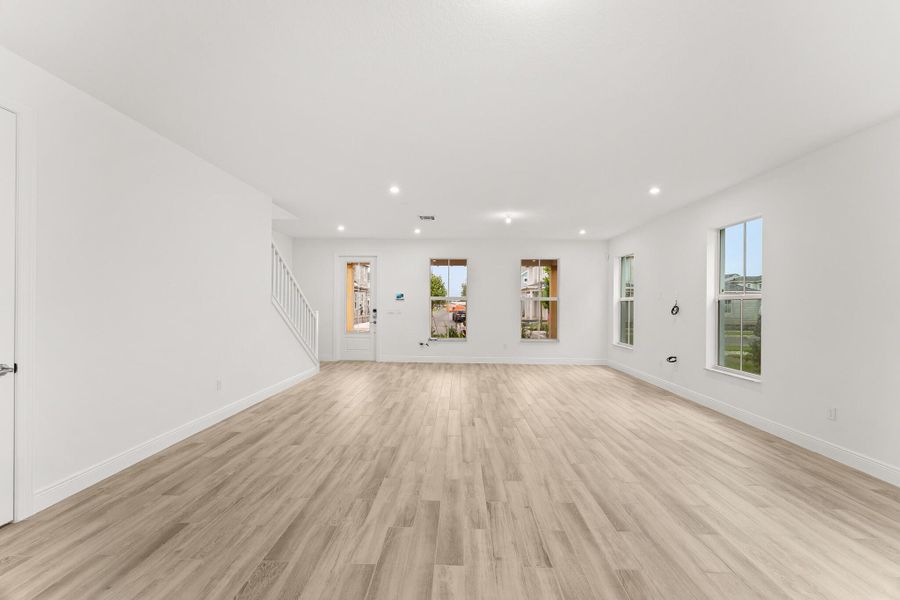 Front exterior of a new home in Newfield - Rosette Park, Palm City, FL, highlighting curb appeal (Image 2). Front exterior of a new home in Newfield - Rosette Park, Palm City, FL, highlighting curb appeal (Image 2).