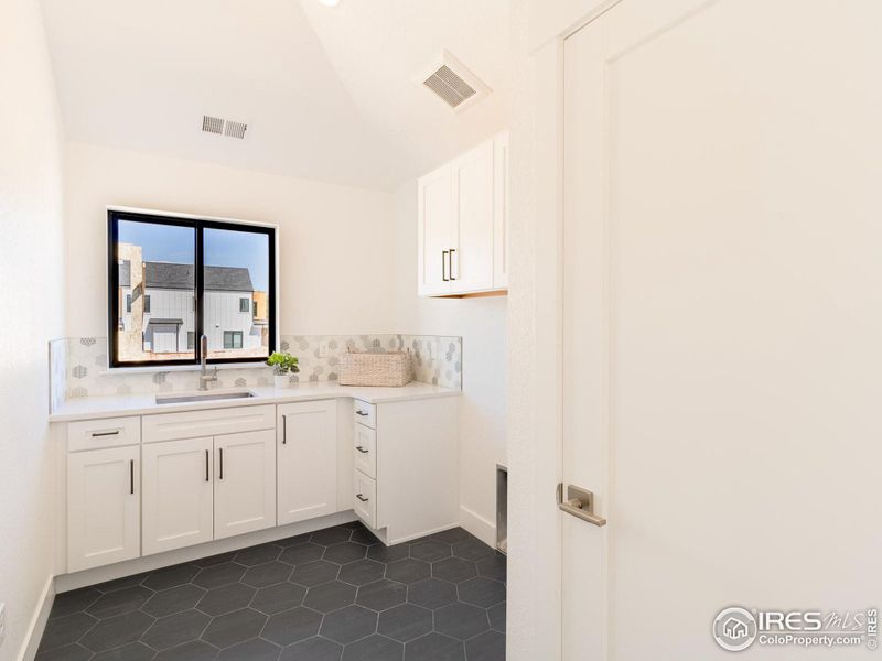 Laundry room inspiration from other new builds in the neighborhood.