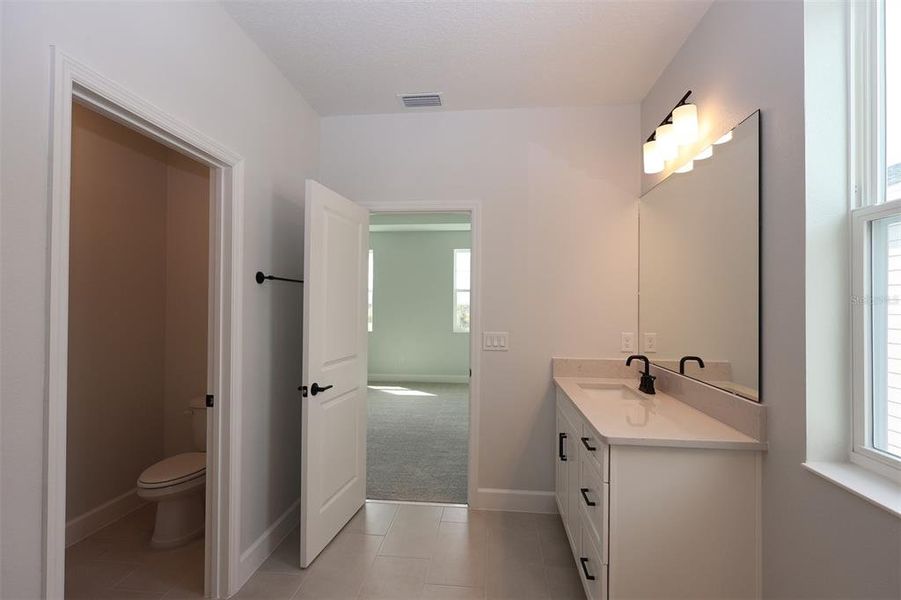 Furnished interior view inside a new home in Lake Star at Ovation, Winter Garden (Image 16).