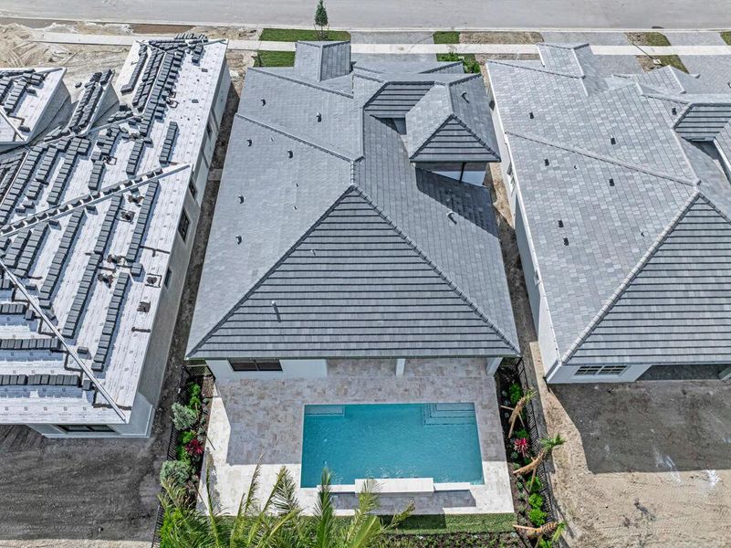 Front exterior of a new home in Esprit at Avenir, Palm Beach Gardens, FL, highlighting curb appeal (Image 25). Front exterior of a new home in Esprit at Avenir, Palm Beach Gardens, FL, highlighting curb appeal (Image 25).