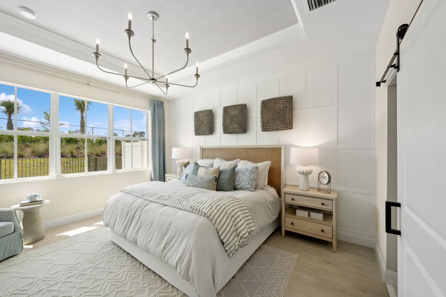 Primary suite with decorative feature wall