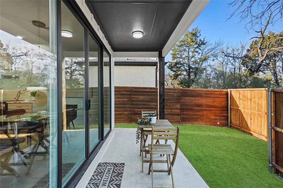 View of patio with a fenced backyard