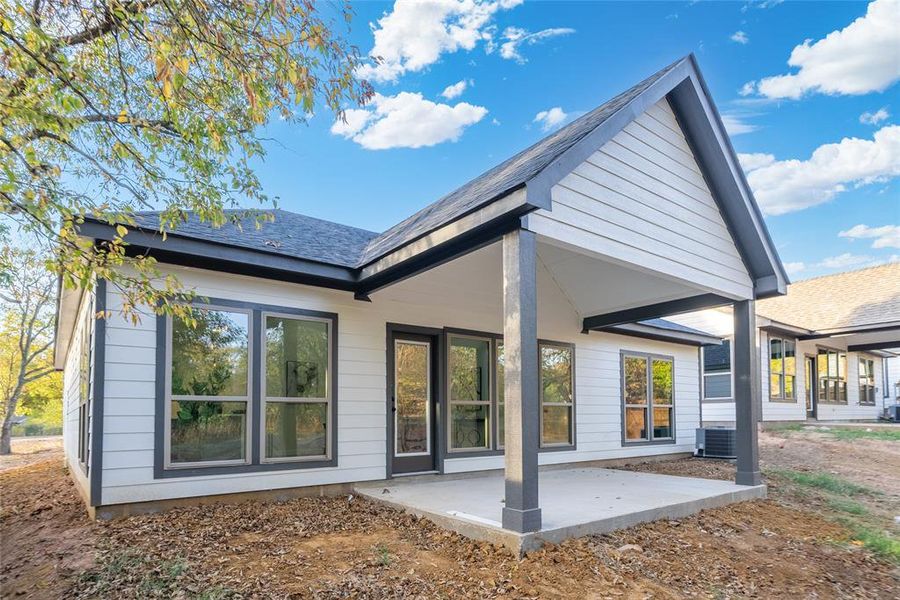 Back of house featuring central AC and a patio