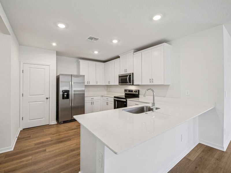 Furnished interior view inside a new home in Ridgehaven - Villas, Ormond Beach (Image 7).