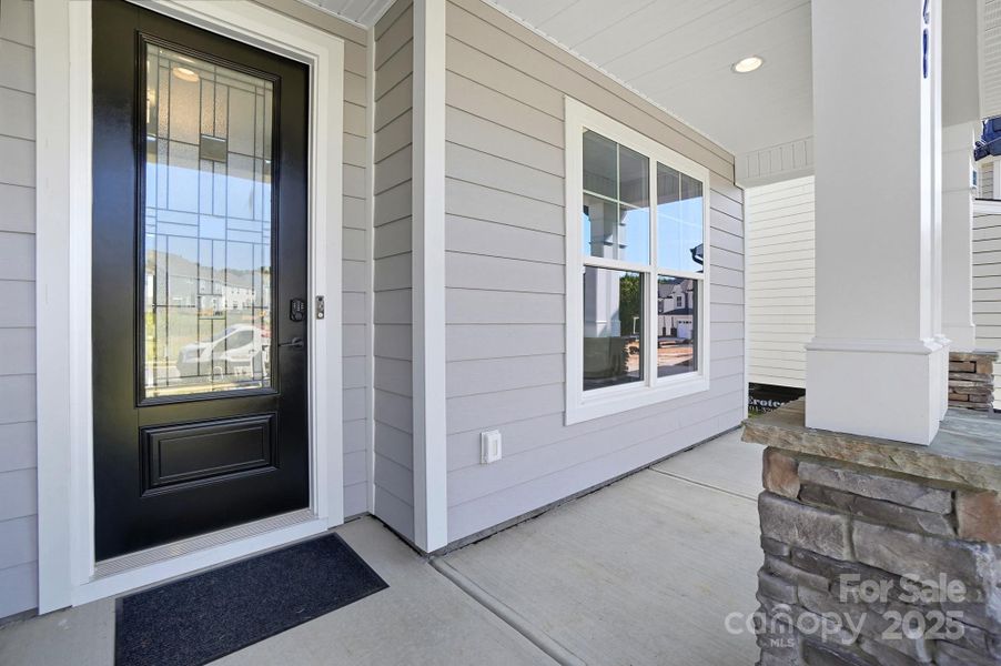 Front exterior of a new home in Summerlin, Mooresville, NC, highlighting curb appeal (Image 2). Front exterior of a new home in Summerlin, Mooresville, NC, highlighting curb appeal (Image 2).
