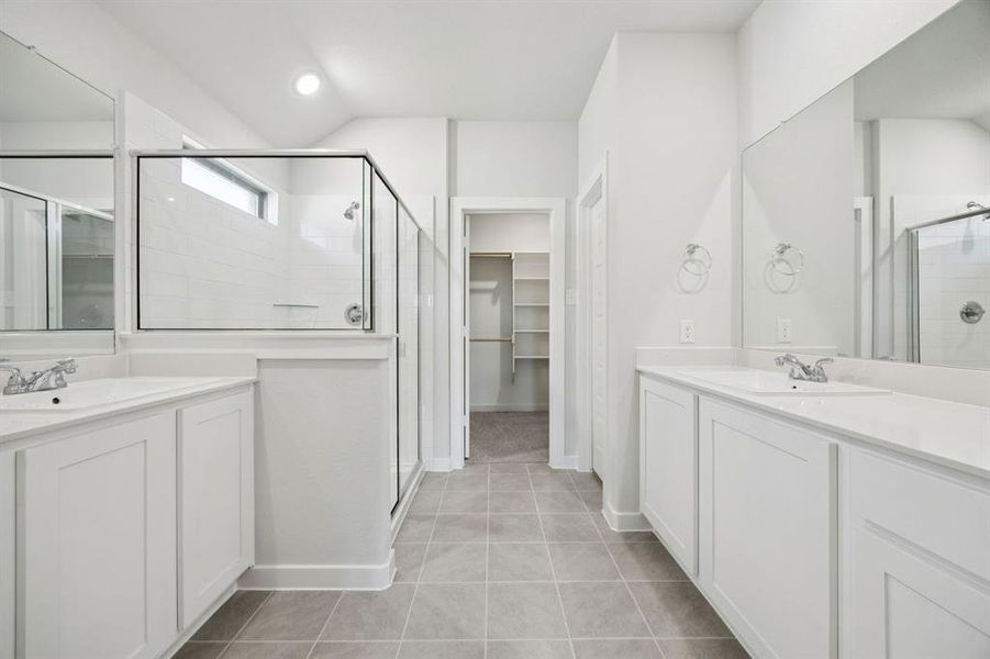 Primary Bathroom in the Heisman home plan by Trophy Signature Homes – REPRESENTATIVE PHOTO