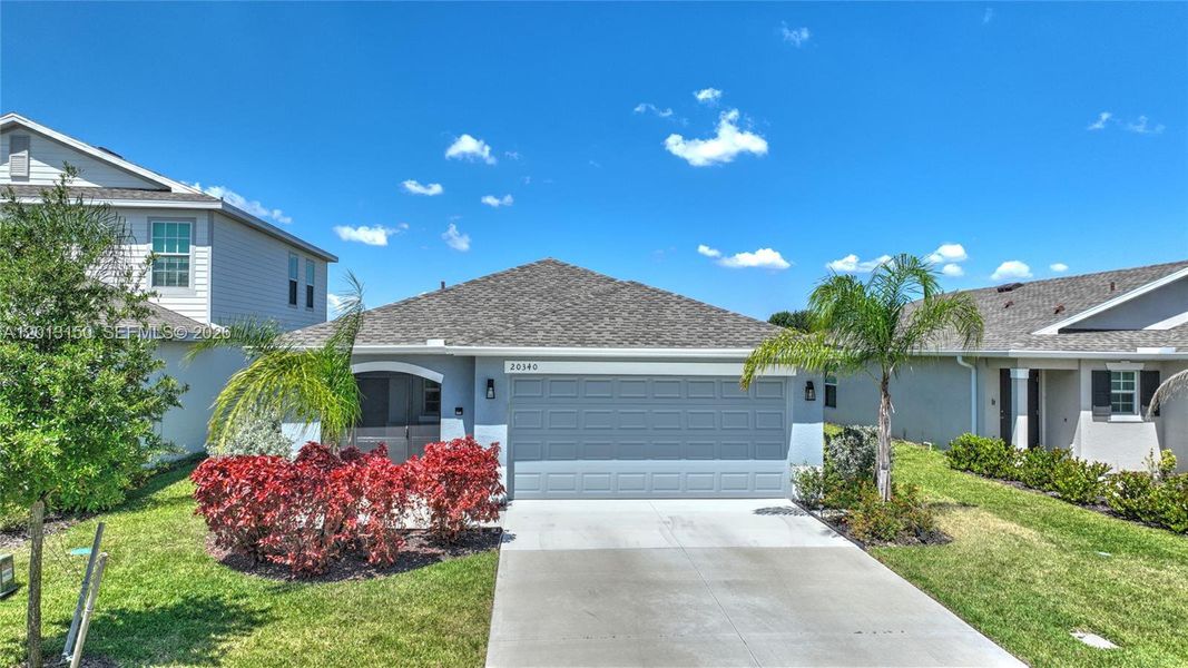 Front exterior of a new home in , Lehigh Acres, FL, highlighting curb appeal (Image 21).