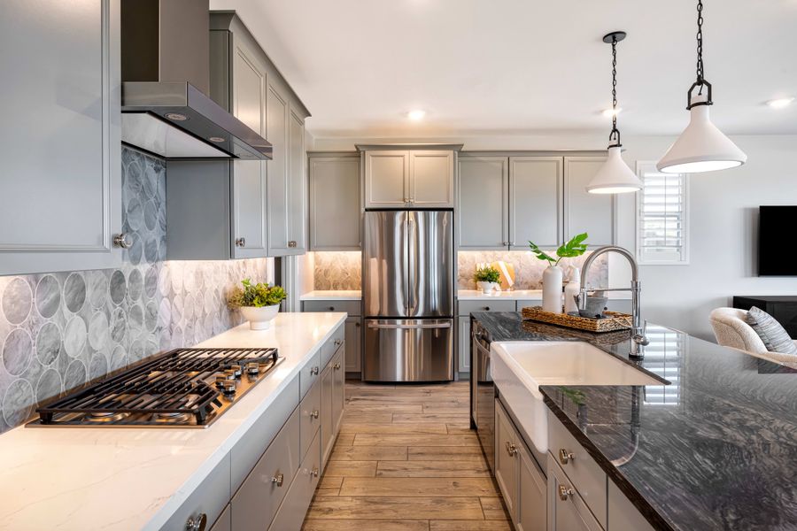 Representative furnished interior of a home built from the Viridian Plan 4004 by Tri Pointe Homes in Waterston Central, Gilbert (Image 6).
