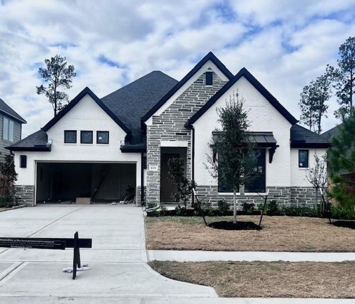 Front exterior of a new home in Evergreen 55', Conroe, TX, highlighting curb appeal (Image 1). Front exterior of a new home in Evergreen 55', Conroe, TX, highlighting curb appeal (Image 1).