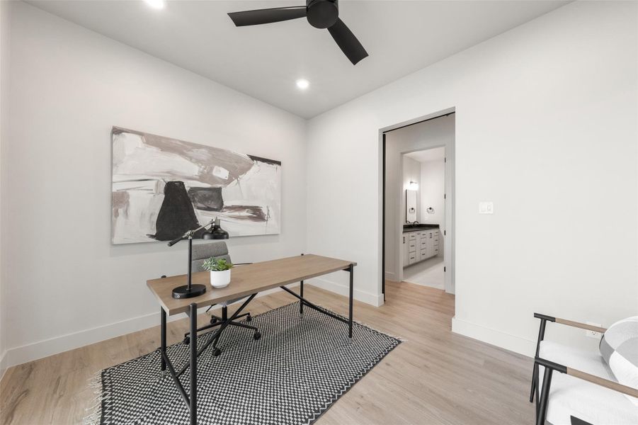 Office area with a ceiling fan, light wood finished floors, baseboards, and recessed lighting Office area with a ceiling fan, light wood finished floors, baseboards, and recessed lighting