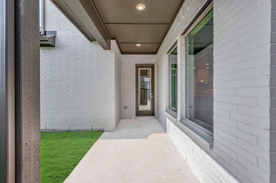 Exterior details and patio area of a home in Goodland – Garden Series, Grand Prairie (Image 4). Exterior details and patio area of a home in Goodland – Garden Series, Grand Prairie (Image 4).