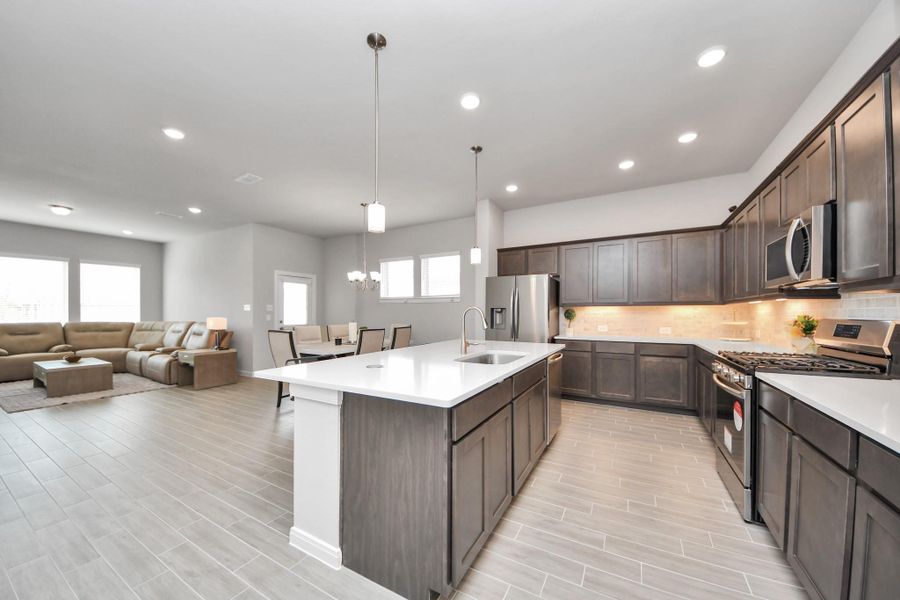 Open concept view. Refrigerator comes with the home!