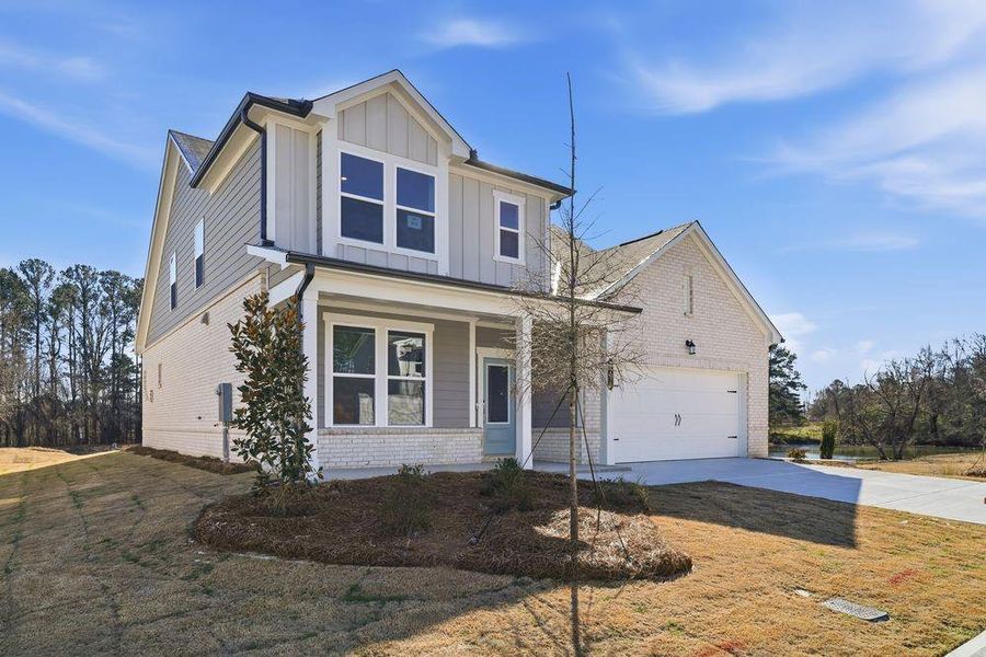 Front exterior of a new home in Windance Lake, Loganville, GA, highlighting curb appeal (Image 1). Front exterior of a new home in Windance Lake, Loganville, GA, highlighting curb appeal (Image 1).
