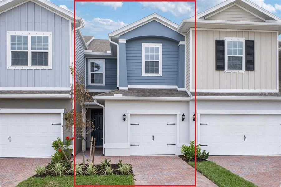 Front exterior of a new home in Townwalk at Babcock Ranch, Punta Gorda, FL, highlighting curb appeal (Image 1).