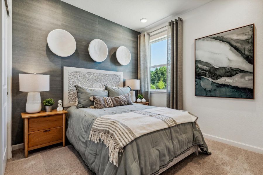 A bedroom with a bed and lamps. A bedroom with a bed and lamps.