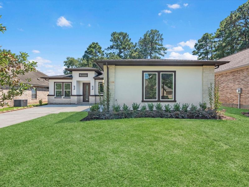 Front exterior of a new home in , Montgomery, TX, highlighting curb appeal (Image 22). Front exterior of a new home in , Montgomery, TX, highlighting curb appeal (Image 22).