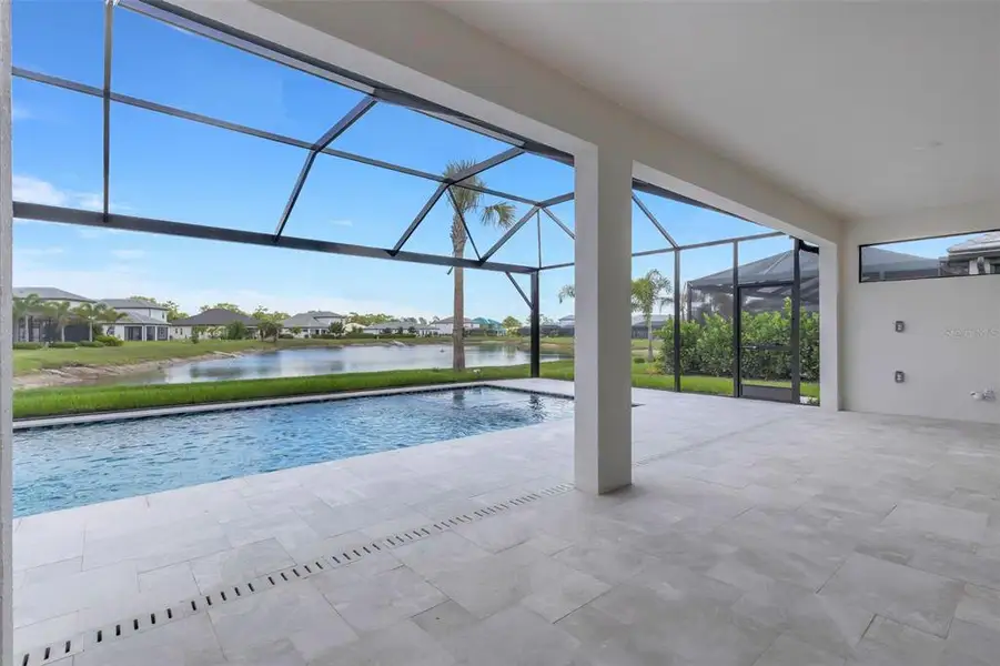 Exterior details and patio area of a home in Cassata Lakes, Nokomis (Image 27).