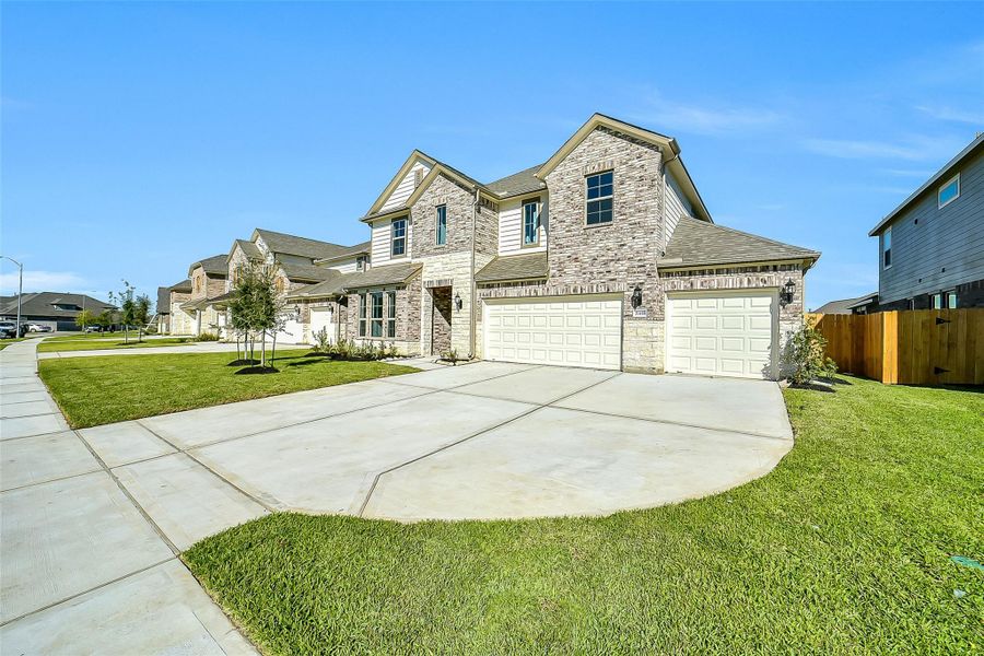 Front exterior of a new home in Stone Creek Ranch, Hockley, TX, highlighting curb appeal (Image 25).