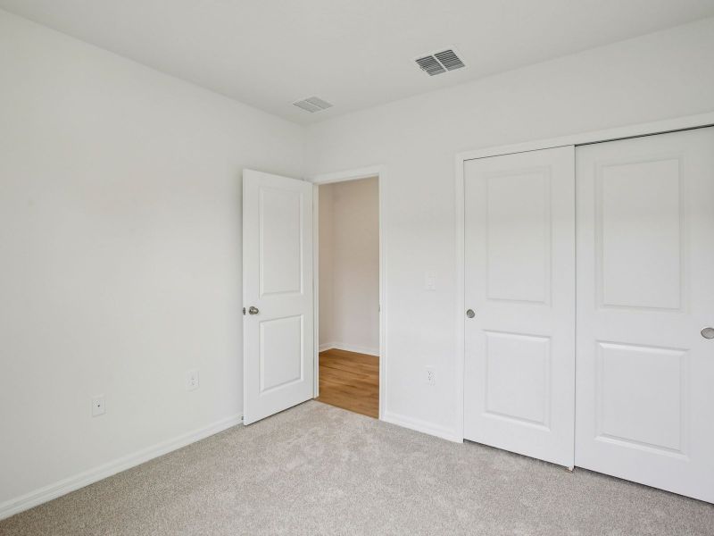 The Secondary Bedroom of the Acadia at 7521 Mia Vine Dr.