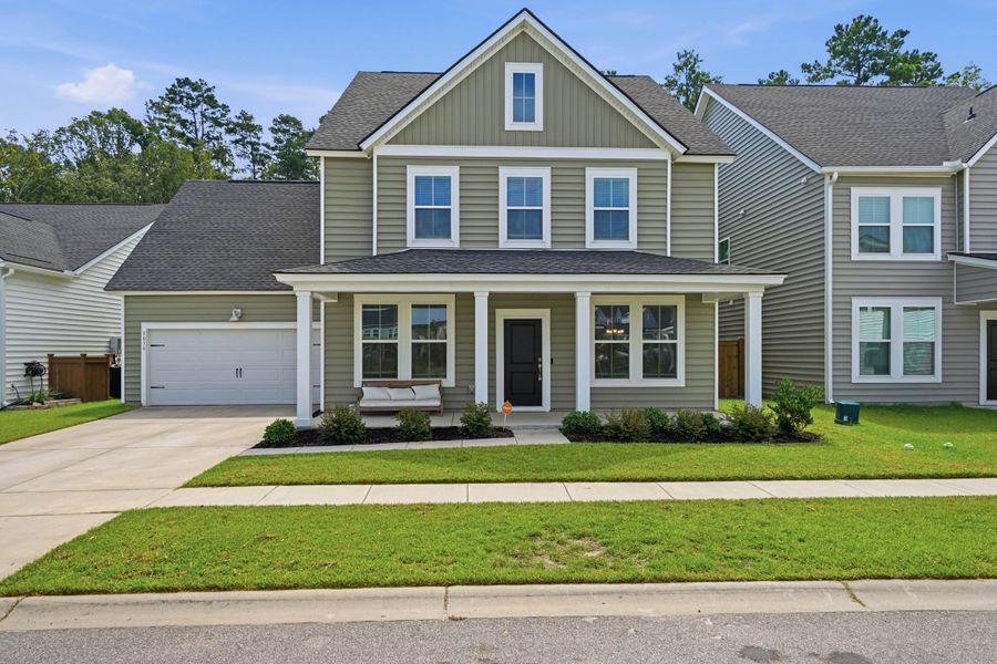 Front exterior of a new home in Sweetgrass at Summers Corner, Summerville, SC, highlighting curb appeal (Image 30). Front exterior of a new home in Sweetgrass at Summers Corner, Summerville, SC, highlighting curb appeal (Image 30).