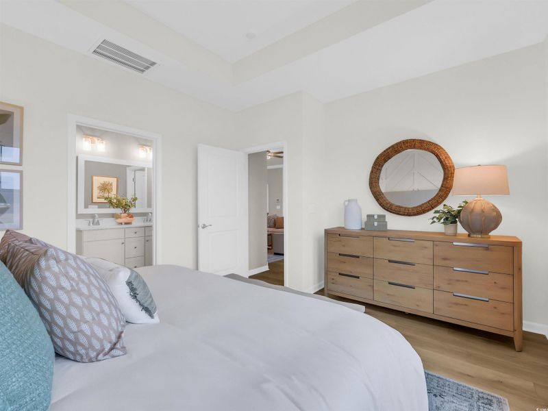 Bedroom featuring light wood-type flooring and baseboards