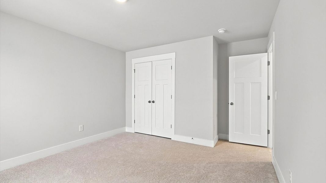 First-rate bedroom with plush carpeting and large windows that provide an open, airy feel First-rate bedroom with plush carpeting and large windows that provide an open, airy feel