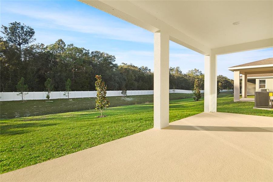 Exterior details and patio area of a home in Seasons at Aurora Oaks, Ocala (Image 3).
