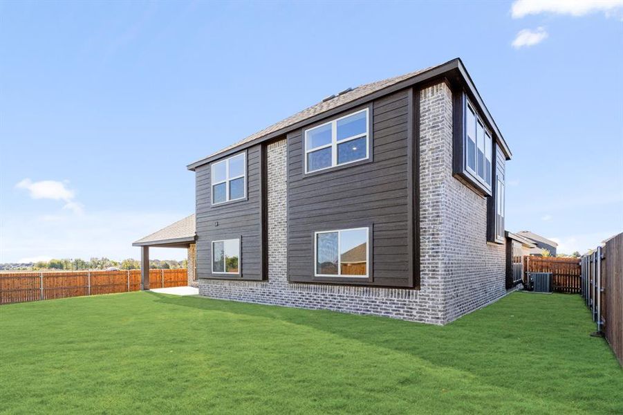 Exterior details and patio area of a home in The Retreat at North Grove 60, Waxahachie (Image 19).