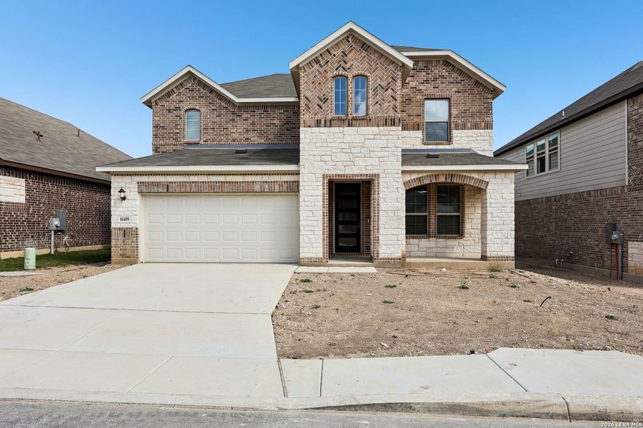 Front exterior of a new home in Fox Falls, Boerne, TX, highlighting curb appeal (Image 27).