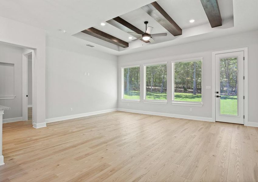 Beam accents are located on the ceiling of the family room.