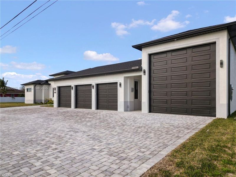 Front exterior of a new home in , Cape Coral, FL, highlighting curb appeal (Image 22).