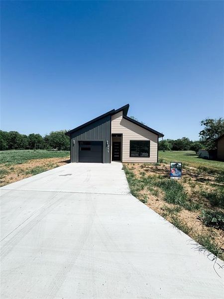 Front exterior of a new home in , Grandview, TX, highlighting curb appeal (Image 23).