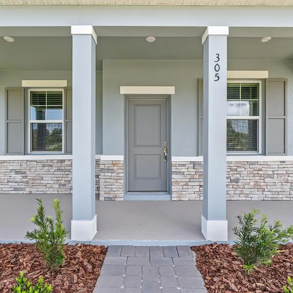 Exterior details and patio area of a home in Spring Walk at the Junction, Debary (Image 3).