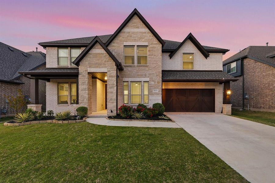 Front exterior of a new home in Union Park, Little Elm, TX, highlighting curb appeal (Image 2). Front exterior of a new home in Union Park, Little Elm, TX, highlighting curb appeal (Image 2).