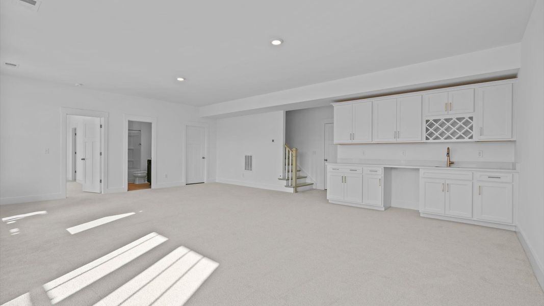 A desirable finished basement offering a bedroom, full bath, and elegant wet bar for effortless entertaining.