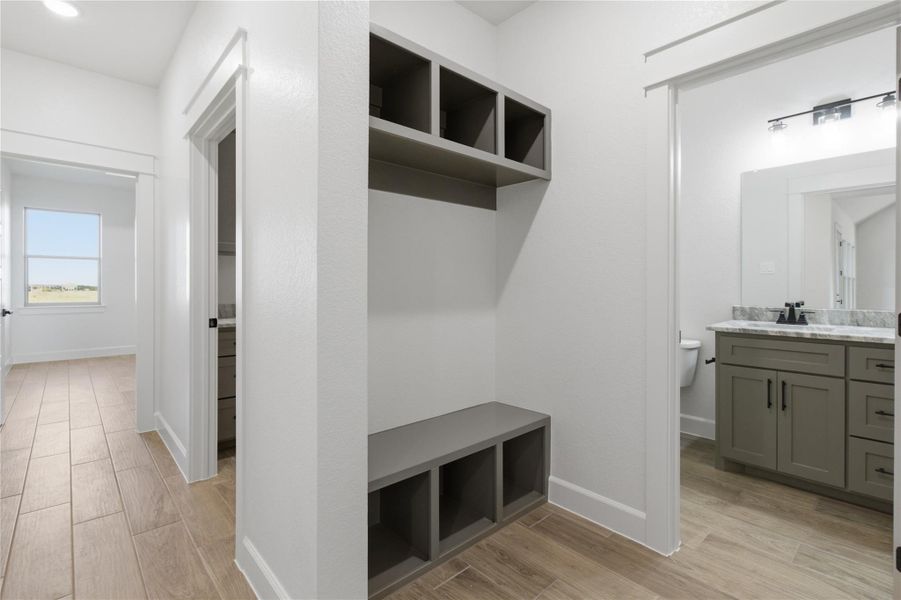A clever mudroom built-in bench and cubbies provide stylish, practical entry organization. A clever mudroom built-in bench and cubbies provide stylish, practical entry organization.