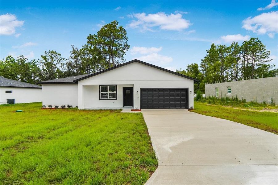 Front exterior of a new home in , Citrus Springs, FL, highlighting curb appeal (Image 2). Front exterior of a new home in , Citrus Springs, FL, highlighting curb appeal (Image 2).