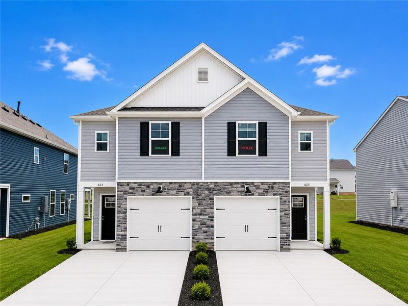 Front exterior of a new home in Champions Village at Cherry Hill, Pendleton, SC, highlighting curb appeal (Image 1). Front exterior of a new home in Champions Village at Cherry Hill, Pendleton, SC, highlighting curb appeal (Image 1).