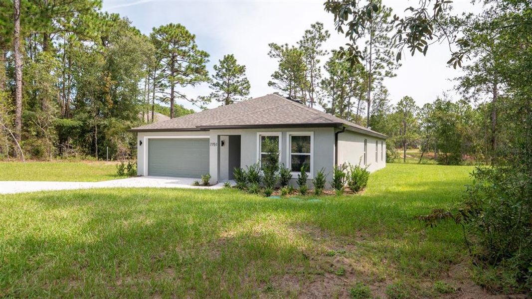 Front exterior of a new home in , Citrus Springs, FL, highlighting curb appeal (Image 16). Front exterior of a new home in , Citrus Springs, FL, highlighting curb appeal (Image 16).
