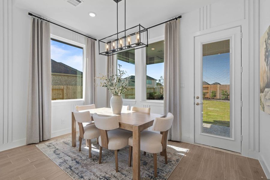 Representative furnished interior of a home built from the Bonneville by Chesmar Homes in University Heights, Round Rock (Image 8).
