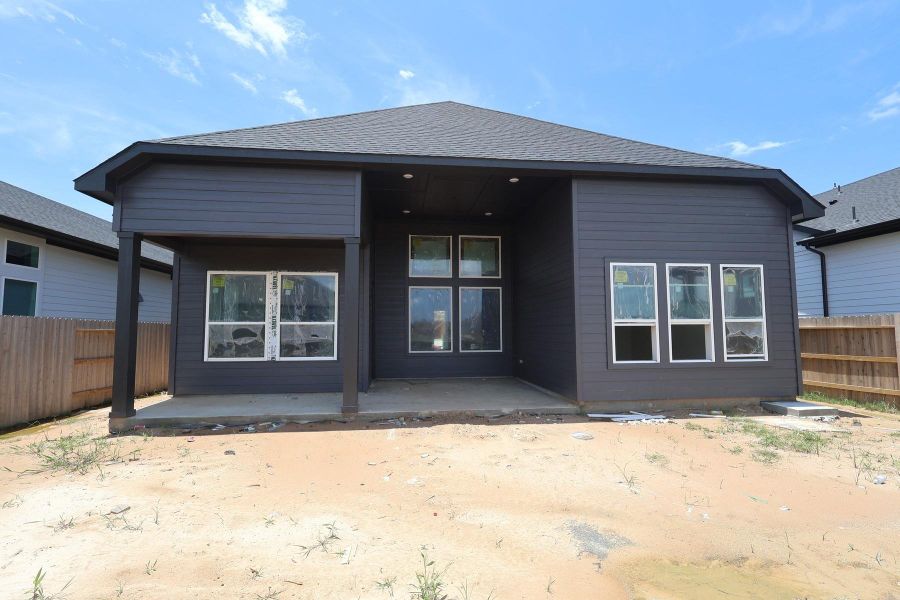 Exterior details and patio area of a home in ARTAVIA - Enclave Collection, Conroe (Image 2).