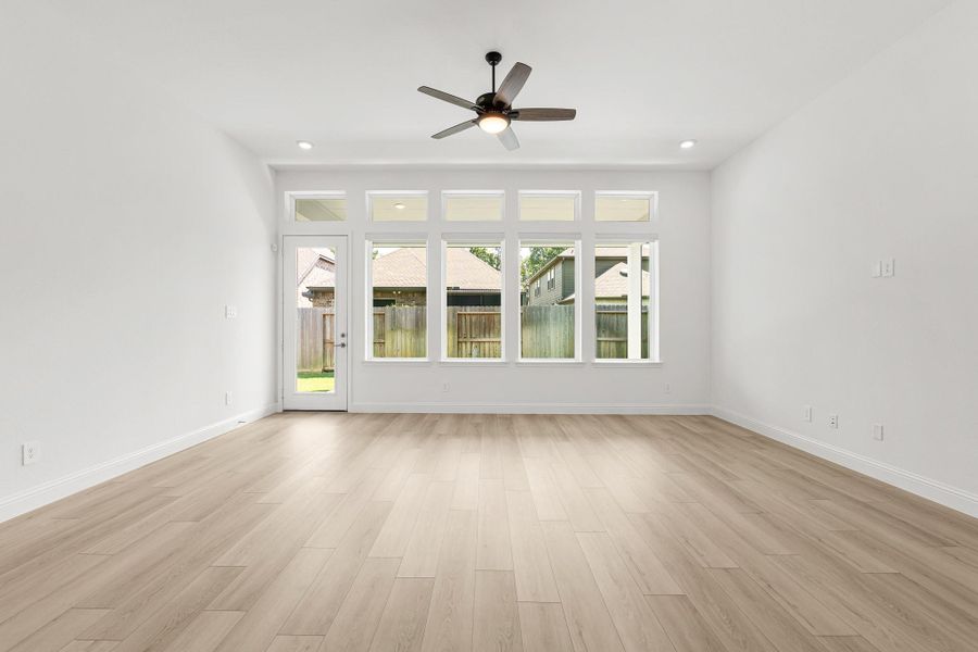 Living room windows with motorized shades Living room windows with motorized shades