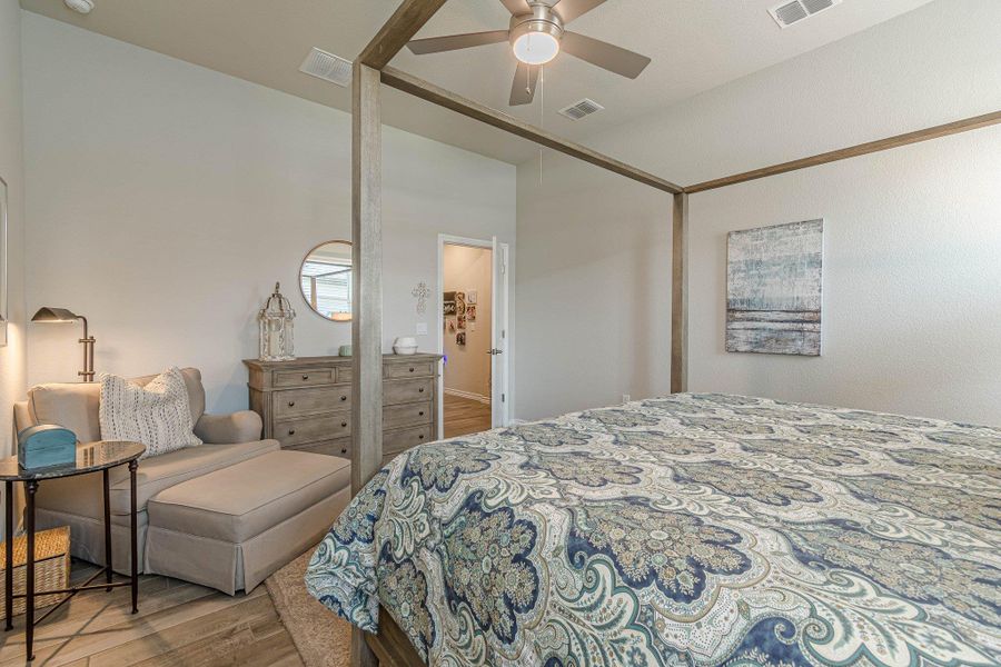 Bedroom featuring wood finished floors and ceiling fan