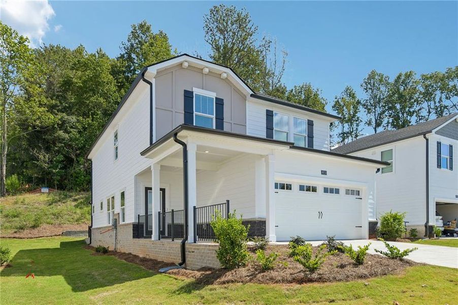 Front exterior of a new home in , Cumming, GA, highlighting curb appeal (Image 1). Front exterior of a new home in , Cumming, GA, highlighting curb appeal (Image 1).