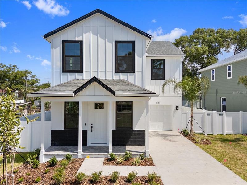 Front exterior of a new home in , St. Petersburg, FL, highlighting curb appeal (Image 23). Front exterior of a new home in , St. Petersburg, FL, highlighting curb appeal (Image 23).