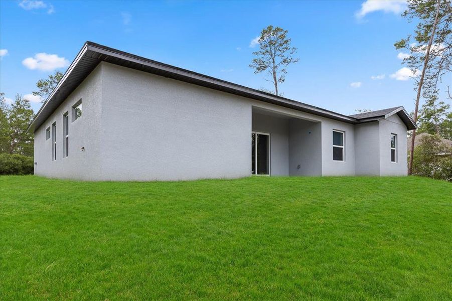 Front exterior of a new home in , Ocala, FL, highlighting curb appeal (Image 2).