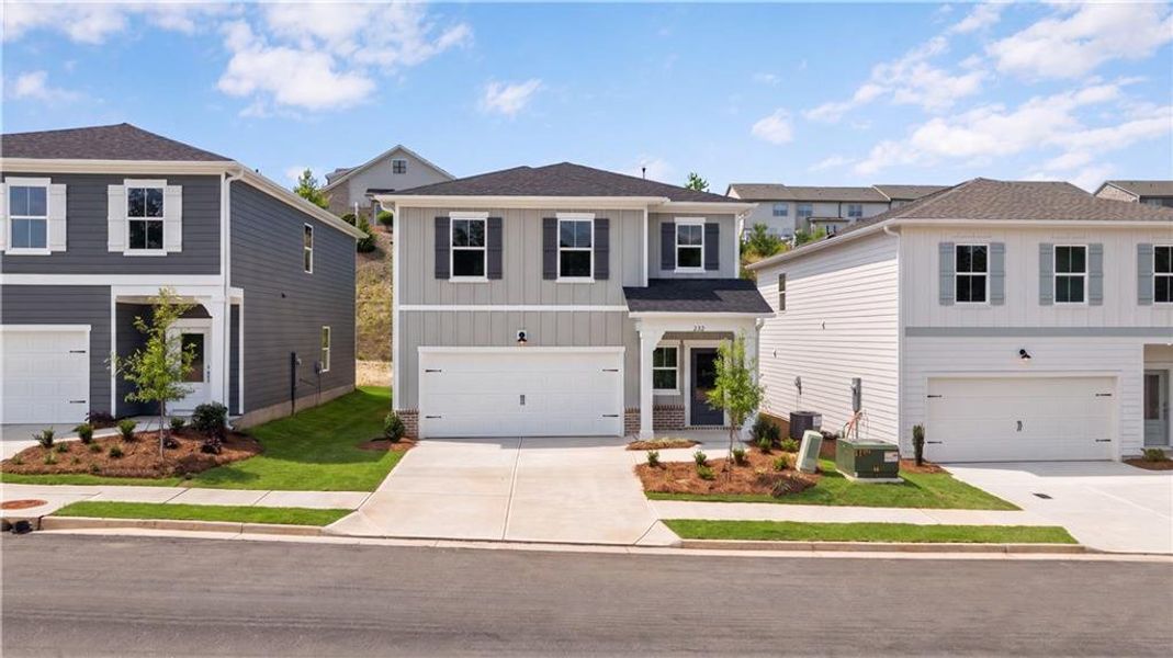 Front exterior of a new home in The Bluffs, Canton, GA, highlighting curb appeal (Image 17).